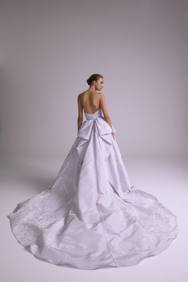 Amsale_Bridal_TATUM_M749_Taffeta_FloralPrint_RuchedBodice_SideBustle_BowDetail_Pockets_Lavender_Ballgown_Back