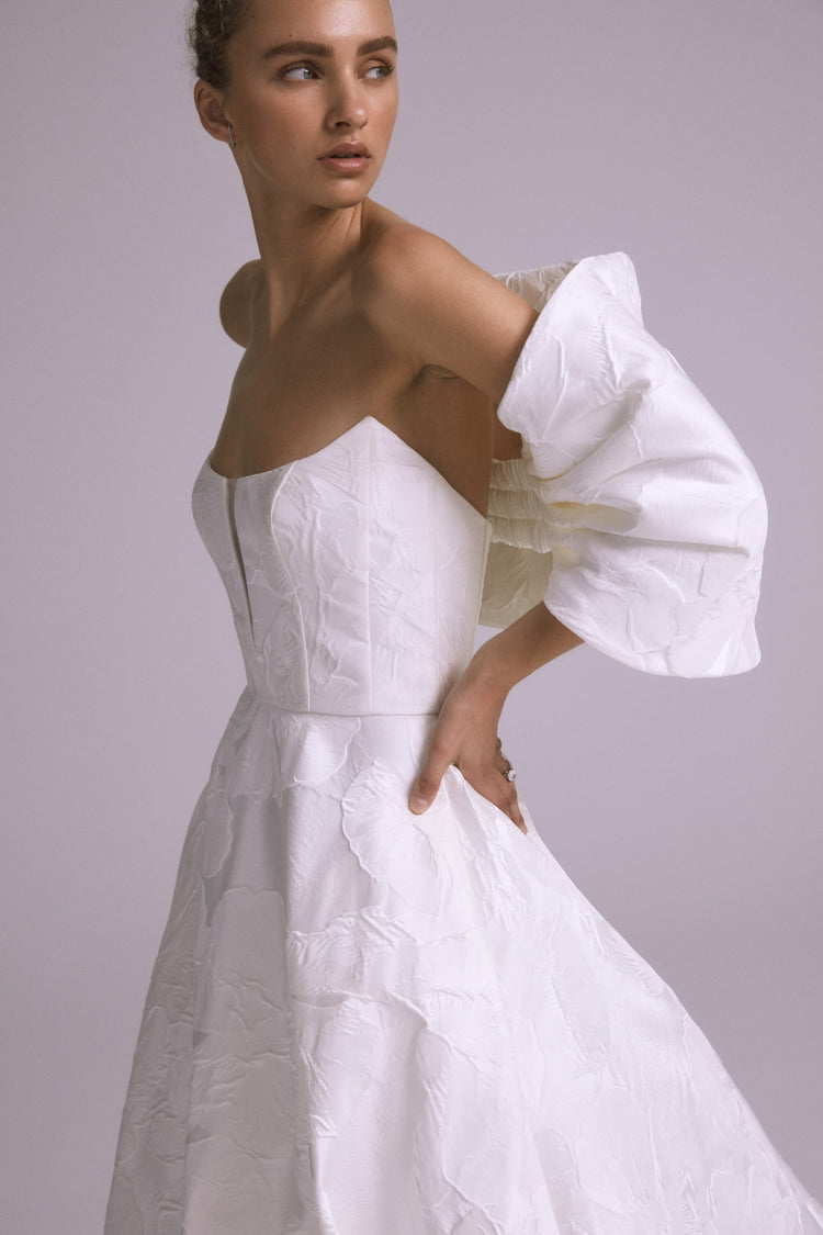 Amsale_Bridal_THEA_A823_FloralJacquard_Strapless_Illusion_Pockets_Ballgown_Mood1